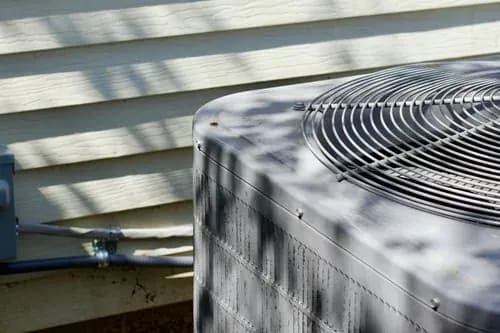 Outdoor air conditioning condenser unit serviced at a Staten Island home