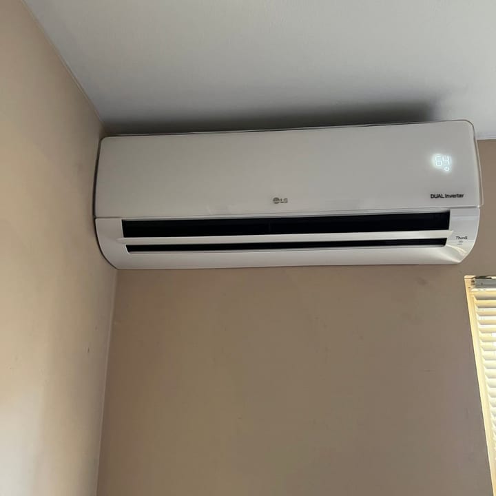 LG ductless mini-split indoor unit mounted high on a bedroom wall