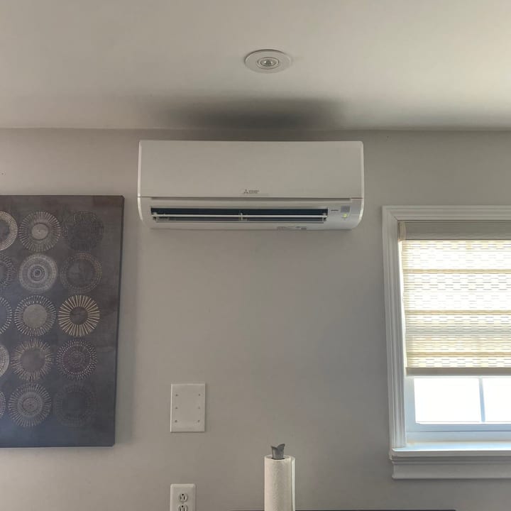 Ductless mini-split indoor unit installed in a living room
