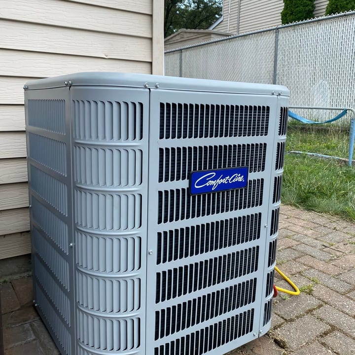 Carrier condenser unit installed beside a house