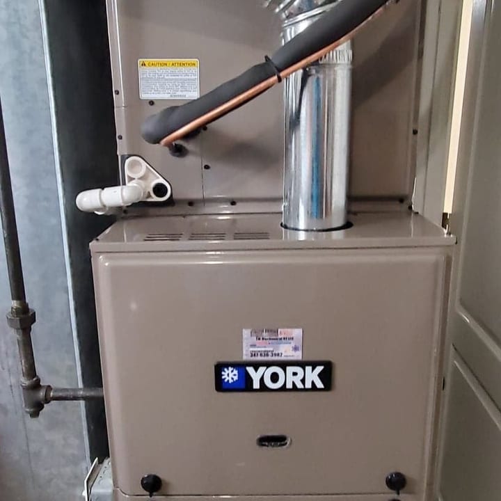 York gas furnace installed in a basement with new flue and gas piping