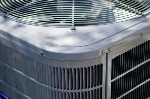 HVAC technician servicing heating and cooling equipment in Staten Island